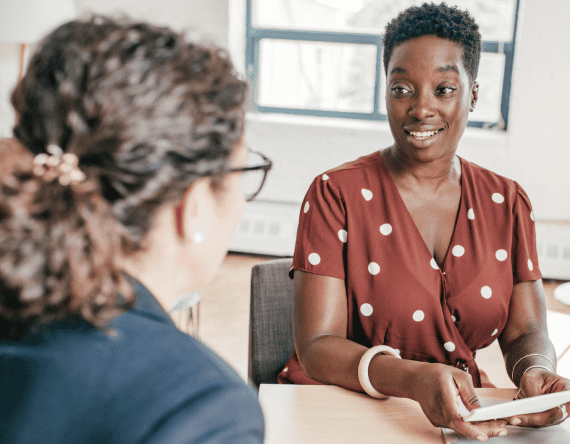 Two women discussing in a consultation