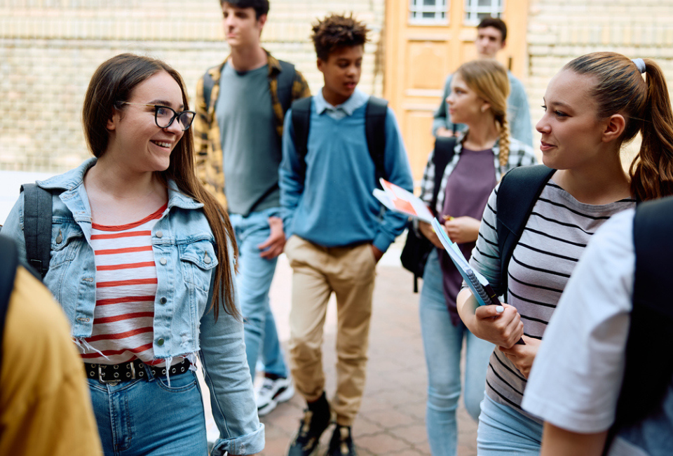 A group of students arrive on campus for orientation after being chosen through the school lottery process.