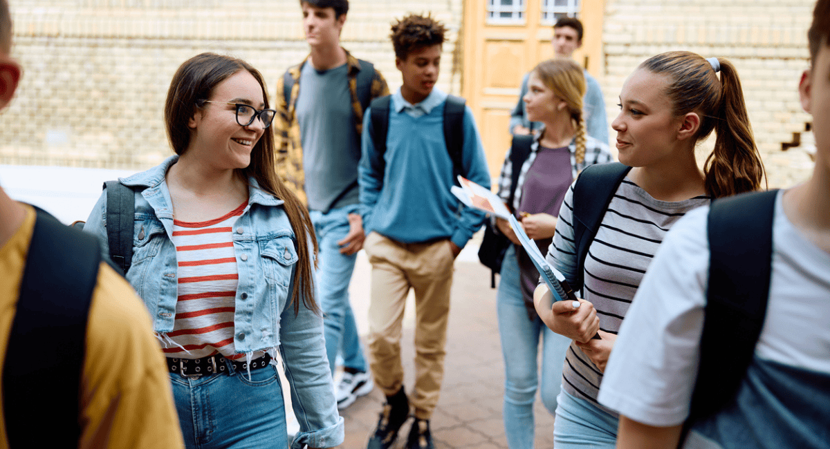 A group of students arrive on campus for orientation after being chosen through the school lottery process.