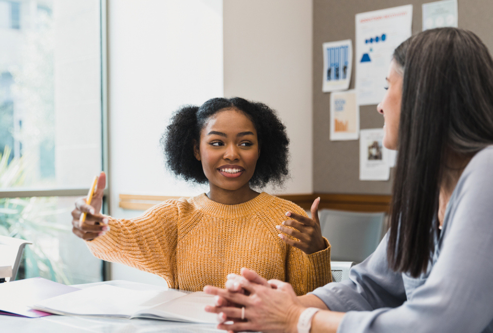 student-meets-with-teacher-to-discuss-plan