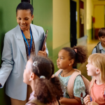 teacher-welcomes-new-students-to-charter-school