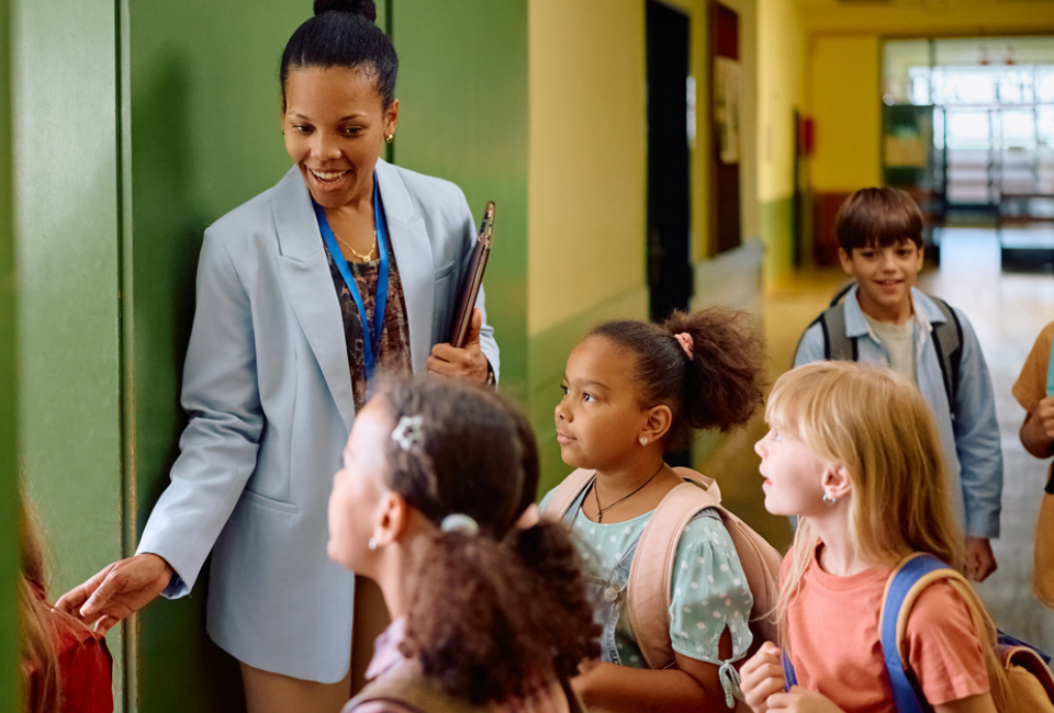 teacher-welcomes-new-students-to-charter-school