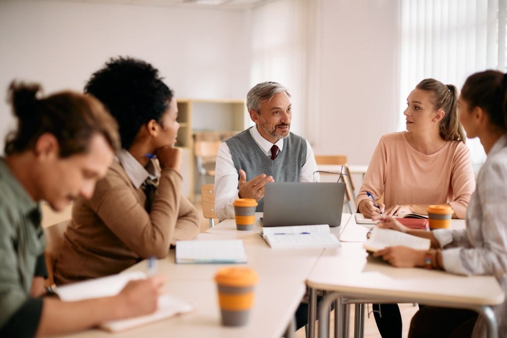 A group of school administrators discuss admissions and attendance processes, which are vital to ensuring charter school funding. 
